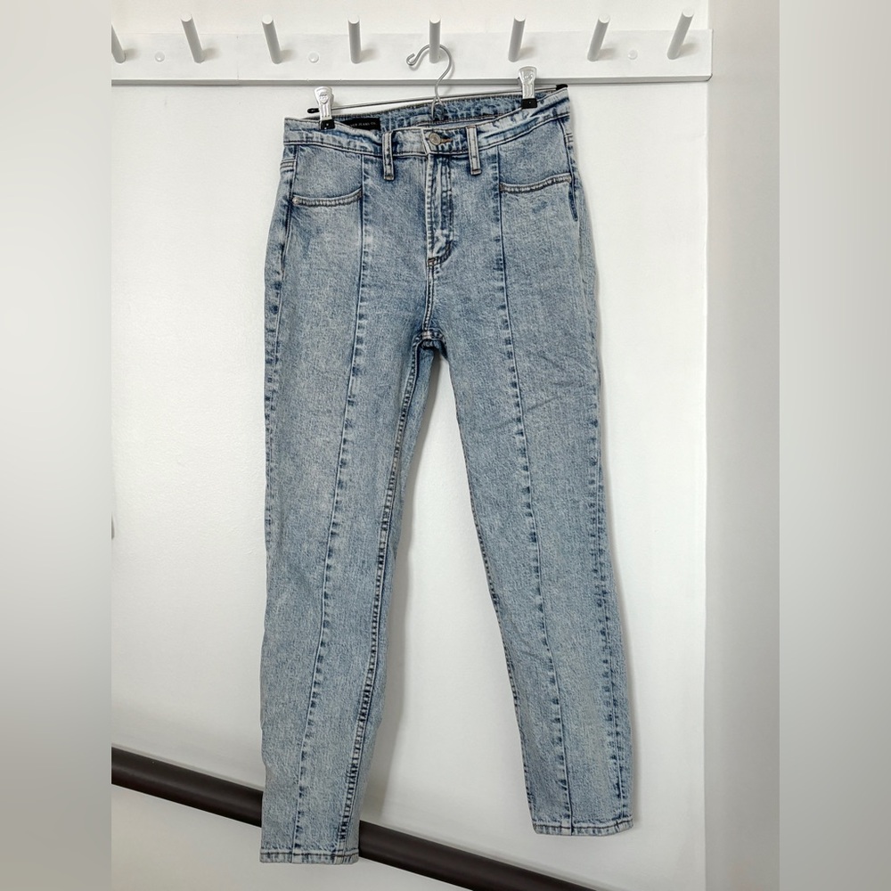 Acid wash tapered jeans